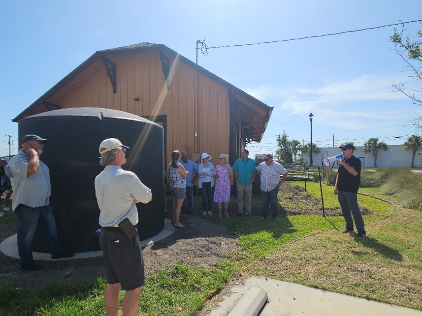 Addressing crowd at Clean Coast Texas project