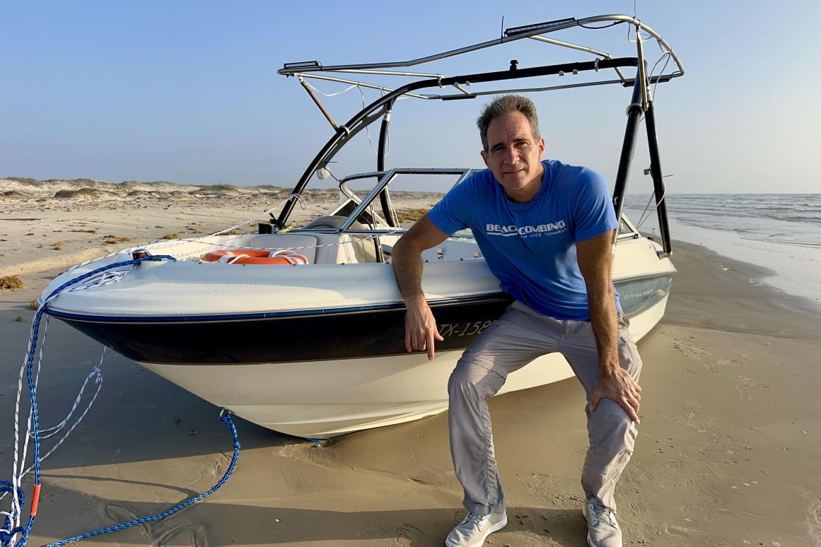 Jace Tunnell standing next to boat without a crew