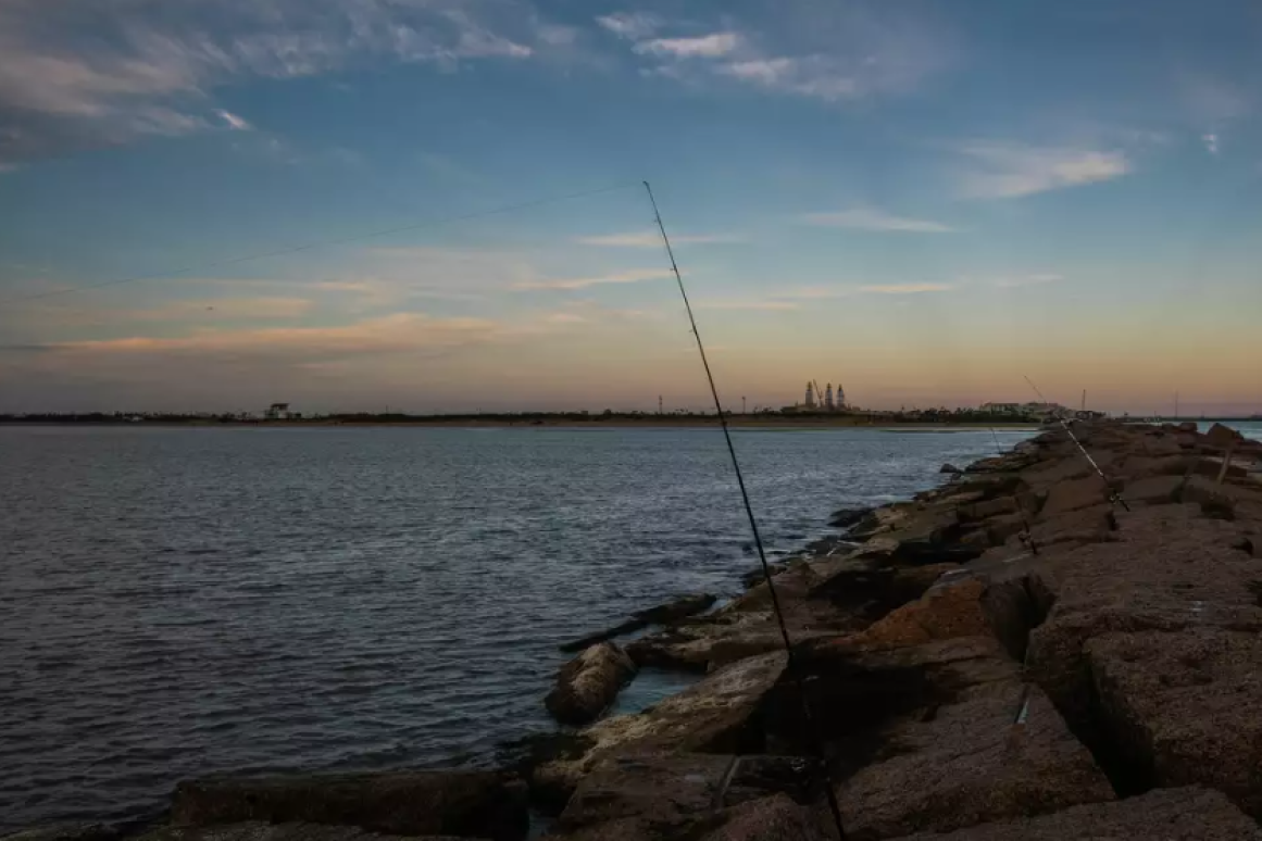 Fishing rods on a jetty on the south Texas coast